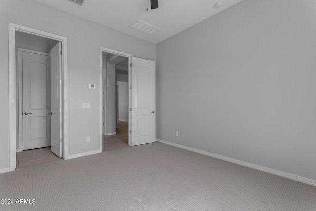 unfurnished bedroom with light carpet