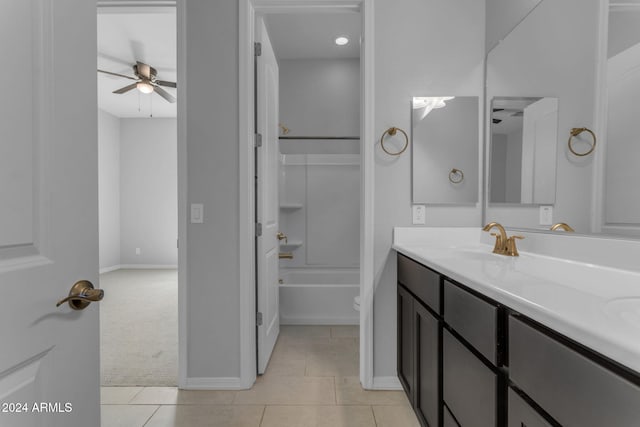 full bathroom featuring ceiling fan, tile patterned flooring,  shower combination, toilet, and vanity