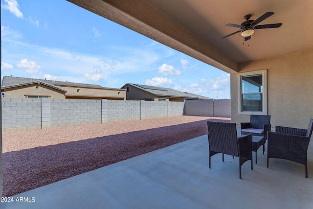 view of patio featuring ceiling fan