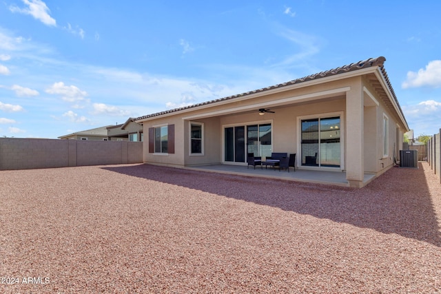 back of property featuring a patio area, ceiling fan, and cooling unit