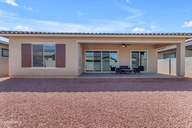 back of house featuring a patio and ceiling fan