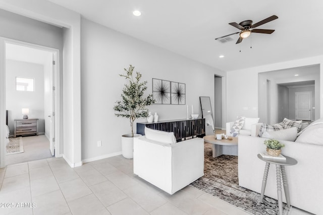 living room with ceiling fan and light colored carpet