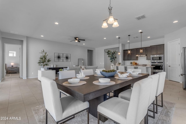 dining area featuring ceiling fan and light tile patterned floors