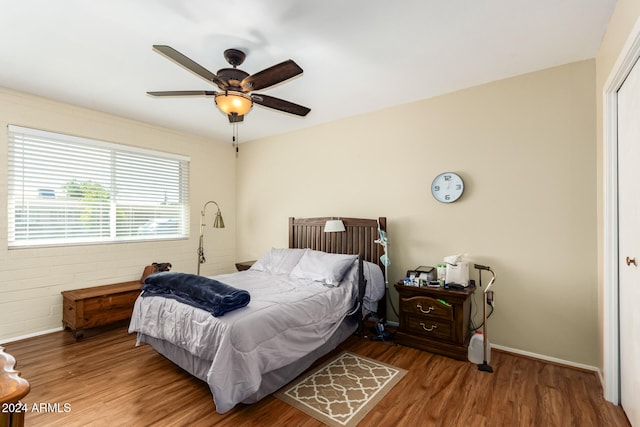 bedroom featuring hardwood / wood-style floors and ceiling fan