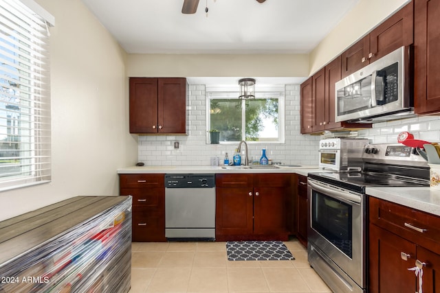 kitchen with decorative backsplash, a healthy amount of sunlight, sink, and stainless steel appliances