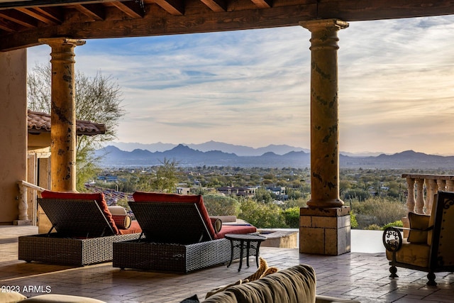 patio terrace at dusk with a mountain view