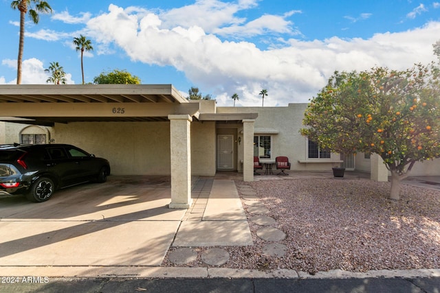 southwest-style home featuring a carport