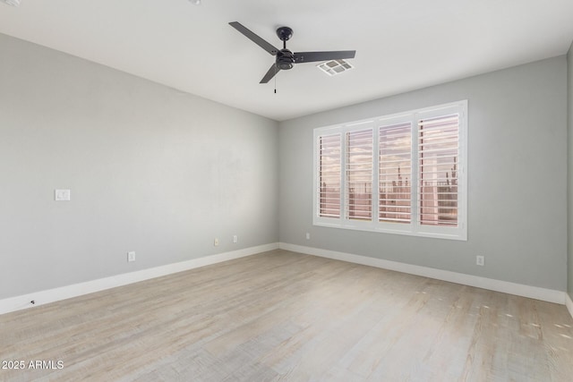 unfurnished room with light wood-style floors, visible vents, ceiling fan, and baseboards