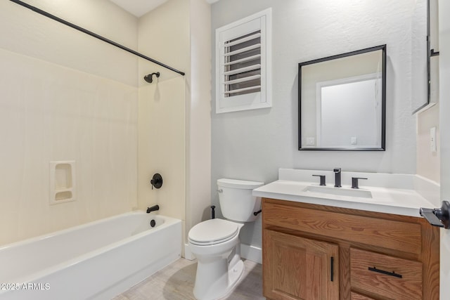 full bathroom with tub / shower combination, vanity, and toilet