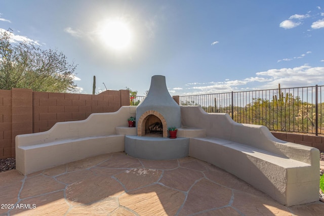 view of patio / terrace featuring fence