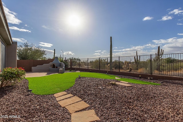 view of yard with a patio area and a fenced backyard