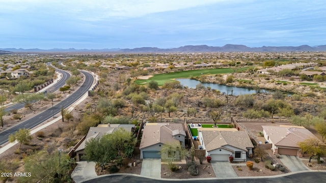 aerial view featuring a residential view and a water and mountain view