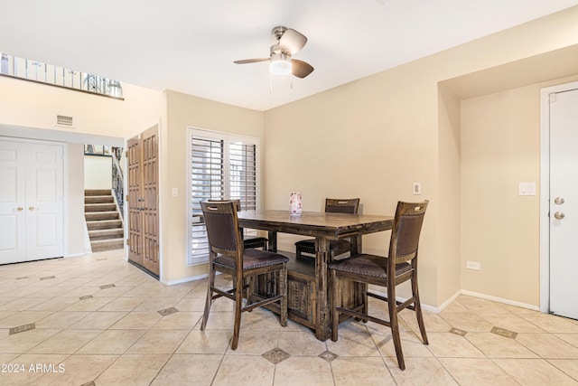 dining room featuring ceiling fan and light tile patterned floors