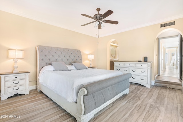 bedroom with ornamental molding and ceiling fan