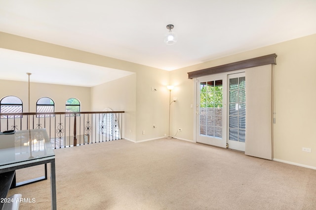 carpeted empty room featuring a healthy amount of sunlight