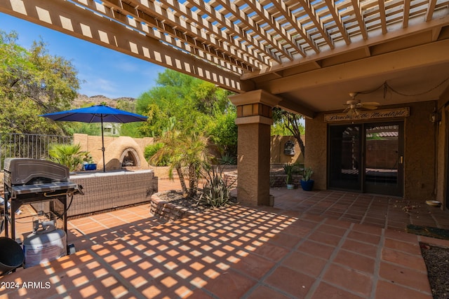 view of patio / terrace featuring outdoor lounge area, a grill, ceiling fan, and a pergola