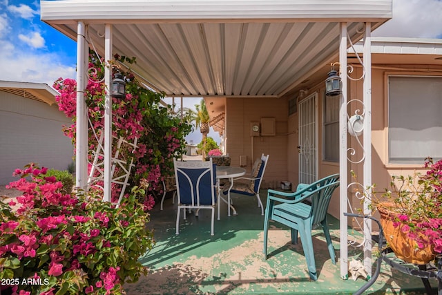 view of patio featuring outdoor dining area