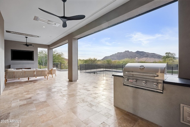 view of patio / terrace with grilling area, an outdoor living space, visible vents, and fence