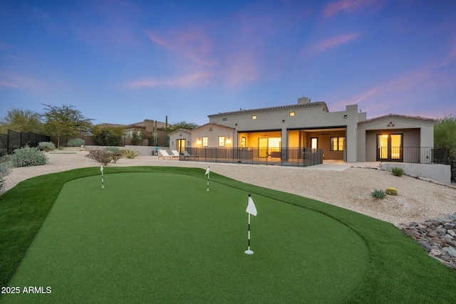 view of property's community with fence and a patio area