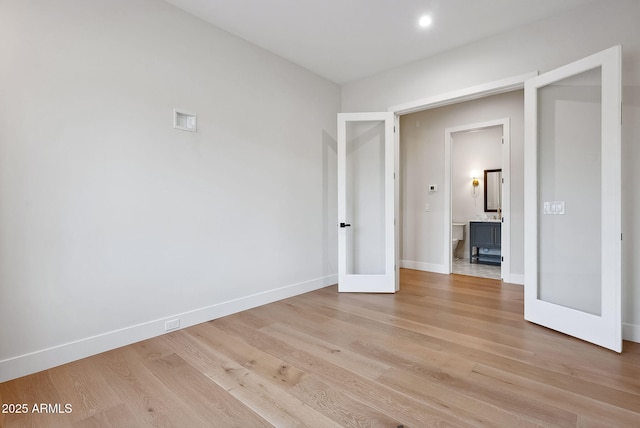 unfurnished bedroom featuring recessed lighting, baseboards, and light wood-style flooring