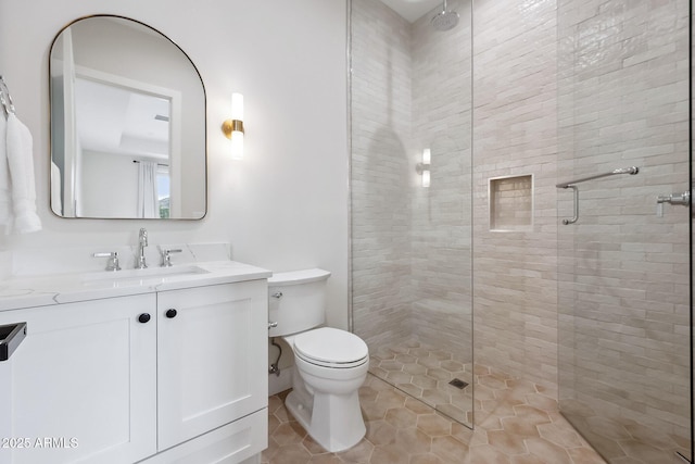 full bathroom with vanity, tile patterned floors, toilet, and a stall shower