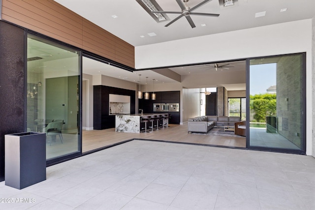 6908 E Cactus Wren Rd, Paradise Valley, AZ 85253 - view of patio featuring a ceiling fan and an outdoor living space