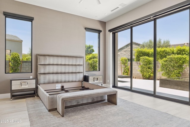 6908 E Cactus Wren Rd, Paradise Valley, AZ 85253 - bedroom with access to exterior and wood finished floors
