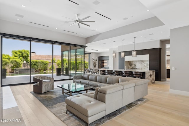 6908 E Cactus Wren Rd, Paradise Valley, AZ 85253 - living area with light wood-type flooring, a ceiling fan, and recessed lighting