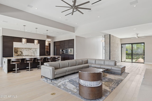 6908 E Cactus Wren Rd, Paradise Valley, AZ 85253 - living area with a ceiling fan, light wood-style floors, and recessed lighting