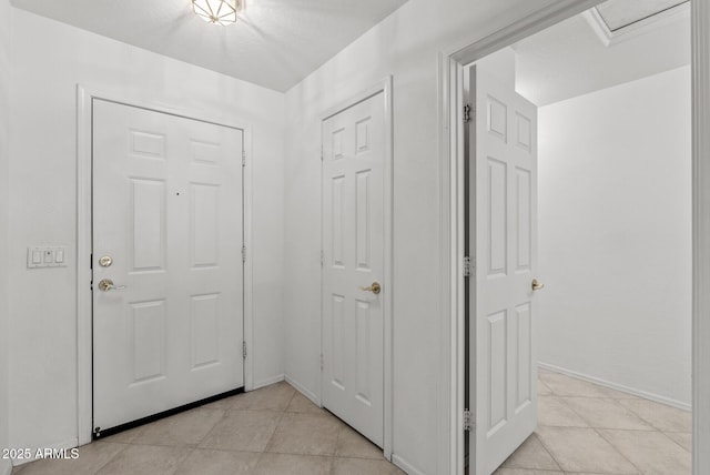 4404 W Ellis St, Laveen, AZ 85339 - hall featuring light tile patterned floors and baseboards