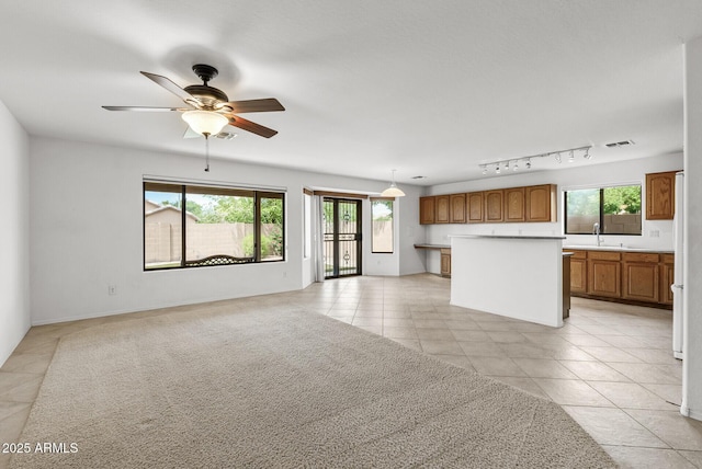 4404 W Ellis St, Laveen, AZ 85339 - unfurnished living room with light tile patterned flooring, a ceiling fan, and a sink