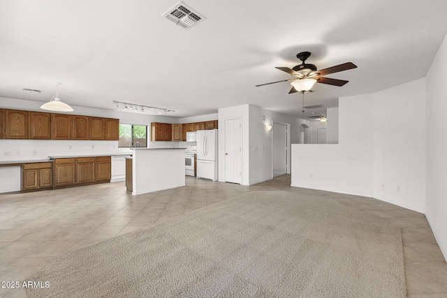 4404 W Ellis St, Laveen, AZ 85339 - unfurnished living room with track lighting, a ceiling fan, light tile patterned flooring, and a sink