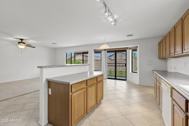 4404 W Ellis St, Laveen, AZ 85339 - kitchen featuring healthy amount of natural light, white dishwasher, light tile patterned floors, and ceiling fan