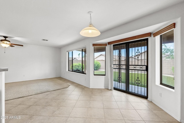 4404 W Ellis St, Laveen, AZ 85339 - spare room featuring ceiling fan and light tile patterned flooring