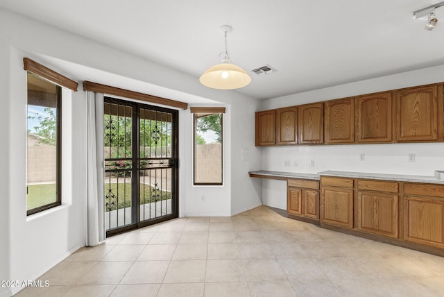 4404 W Ellis St, Laveen, AZ 85339 - kitchen with plenty of natural light and brown cabinetry