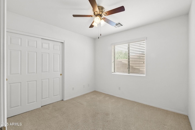4404 W Ellis St, Laveen, AZ 85339 - unfurnished bedroom with carpet floors, a closet, baseboards, and ceiling fan