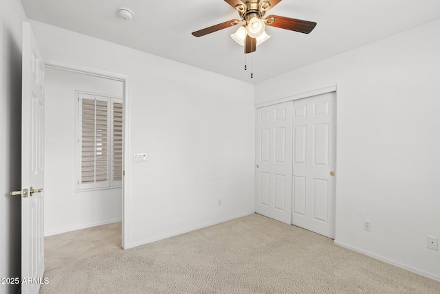4404 W Ellis St, Laveen, AZ 85339 - unfurnished bedroom featuring carpet, a closet, baseboards, and a ceiling fan