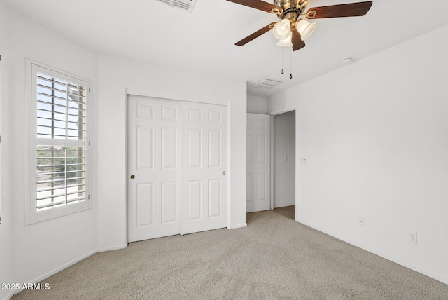 4404 W Ellis St, Laveen, AZ 85339 - unfurnished bedroom featuring carpet, a closet, and ceiling fan