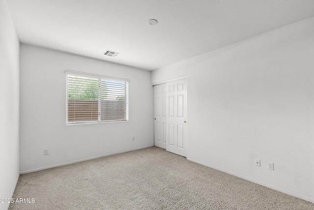 4404 W Ellis St, Laveen, AZ 85339 - spare room featuring carpet flooring and baseboards