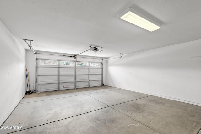 4404 W Ellis St, Laveen, AZ 85339 - garage featuring a garage door opener and baseboards