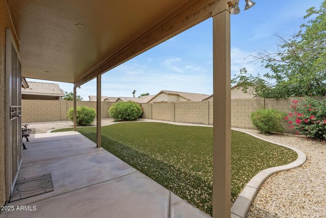 4404 W Ellis St, Laveen, AZ 85339 - fenced backyard with a patio area