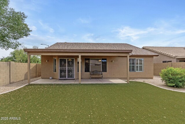 4404 W Ellis St, Laveen, AZ 85339 - back of house with a patio and stucco siding