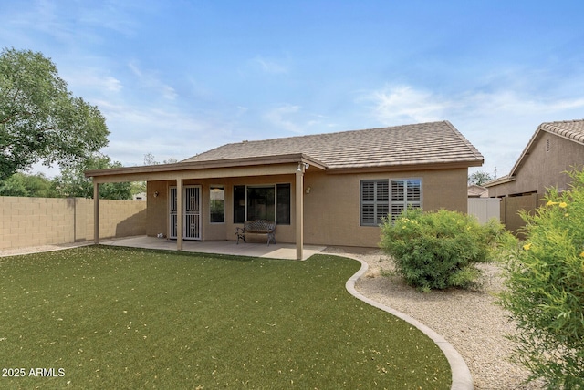 4404 W Ellis St, Laveen, AZ 85339 - back of house with a patio area and stucco siding