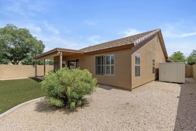 4404 W Ellis St, Laveen, AZ 85339 - rear view of house with stucco siding