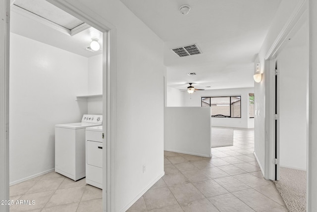 4404 W Ellis St, Laveen, AZ 85339 - hall with independent washer and dryer, light tile patterned floors, and baseboards