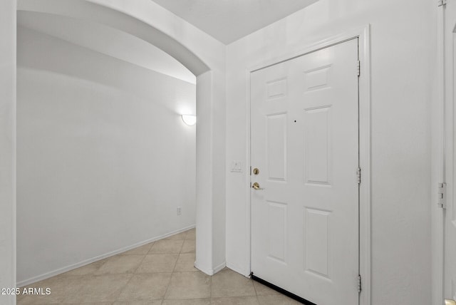 4404 W Ellis St, Laveen, AZ 85339 - entrance foyer featuring arched walkways, baseboards, and light tile patterned flooring