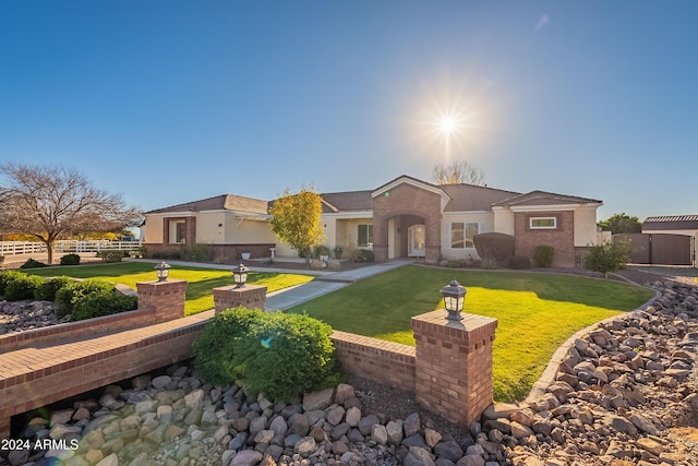 ranch-style house with a front yard