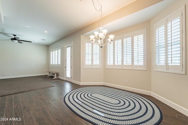 entryway featuring ceiling fan with notable chandelier and dark hardwood / wood-style flooring