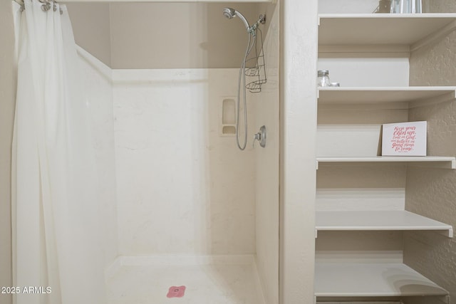 bathroom featuring a shower with curtain