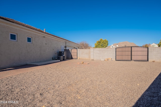 view of yard with central AC